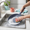 Set of three blue non-stick pans and lidded saucepan on kitchen counter, modern style