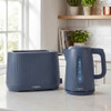 Blue electric kettle being filled at kitchen sink, matching blue toaster on counter