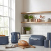 Blue bread bin and three matching canisters for tea, coffee and sugar on kitchen counter
