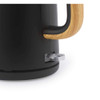Close-up of black kettle with wood-effect handle and power button, studio background
