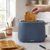 Blue 2-slice toaster on kitchen counter with toast, marmalade, and butter
