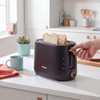 Black 2-slice toaster in use on kitchen counter with two pieces of bread