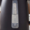 Close-up of black kettle water level indicator showing measurements from 0.5L to 1.7L