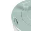Green salad spinner lid with handle, close-up view.
