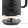 Black electric kettle on rose gold 360 swivel base, showing rotating arrows.