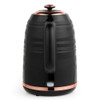 Black electric kettle with copper accents, shown from the rear handle side.