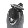 Black leopard print kettle with open lid, showing spout filter
