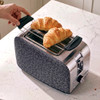Two-slice toaster with grey leopard print front and stainless steel sides