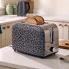 Black and grey leopard print 2-slice toaster with two slices of toast