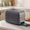 Black and grey leopard print 2-slice toaster with two slices of toast