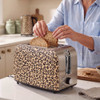 Beige leopard print 2-slice toaster with toast popping up