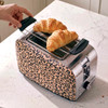 Beige leopard print two-slice toaster with croissants