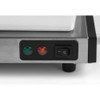 Stainless steel appliance control panel with green and red indicator lights and power switch