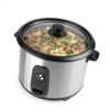 Stainless steel rice cooker with cooked rice, plastic scoop, and measuring cup