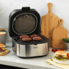 Promotional graphic: Progress banner showing grilled meat, burger and chips, and corn to highlight healthier cooking results.