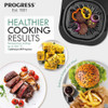 Hand pressing control panel on black and silver electric grill air fryer on kitchen counter