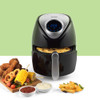 Black digital air fryer with fries in basket, product display with assorted cooked food