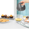 Gunmetal electric hand mixer with turbo button, shown side view