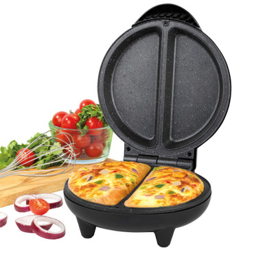 Electric pie maker with two golden pies, open lid, fresh ingredients in background