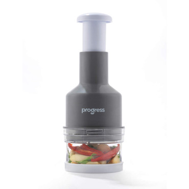 Grey Progress manual food chopper with clear base, shown filled with vegetables.