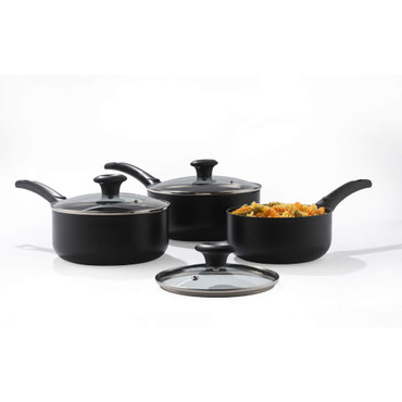 Set of three black saucepans with glass lids, one filled with pasta, on white background