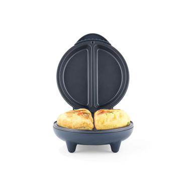 Electric omelette maker with two cooked omelettes in blue appliance