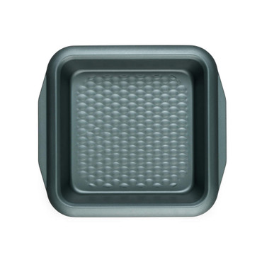 Green square non-stick cake tin with textured base, top-down view