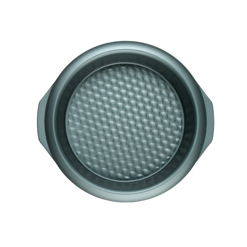 Round green non-stick cake tin with textured base, top-down view
