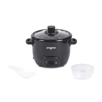 Black rice cooker with glass lid, plastic spoon and measuring cup, shown on white background