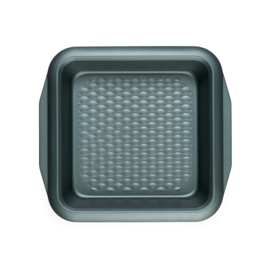 Green square non-stick cake tin with textured base, top-down view