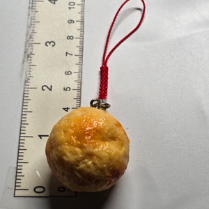 Takoyaki? (WEIRD TO SEE IT WITHOUT SAUCE SO MAYBE I'M WRONG) Mini Figure Keychain Charm Strap - 20260720
