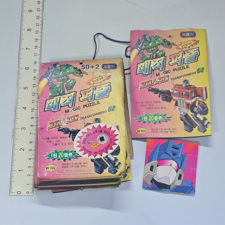 Vintage Korean Official Folding Puzzle Transformers Card Set (1997) (20X PACKS, HEAVY WEATHER DAMAGE. OPENED ONE TO CHECK THE CONTENTS AND SOME FLAPS WERE STUCK TOGETHER) - 20260429 - RWK639  - BKSHF