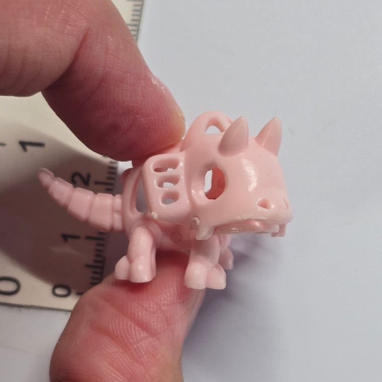 Meiji Kasekidon Plastic Dinosaur Skeleton Mini Figure - Pink Triceratops - 20260909