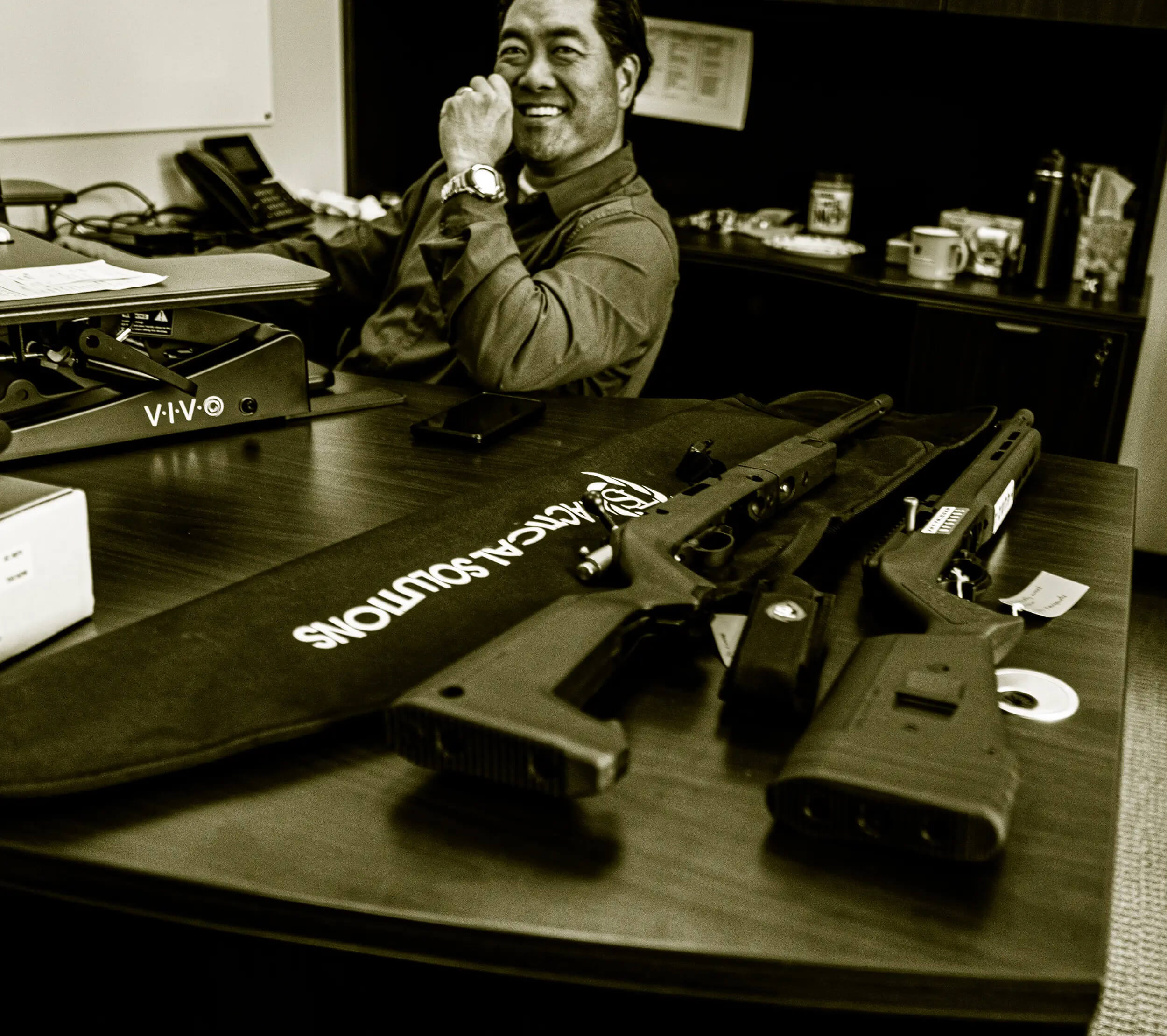 TacSol CEO at his desk with TacSol Firearms