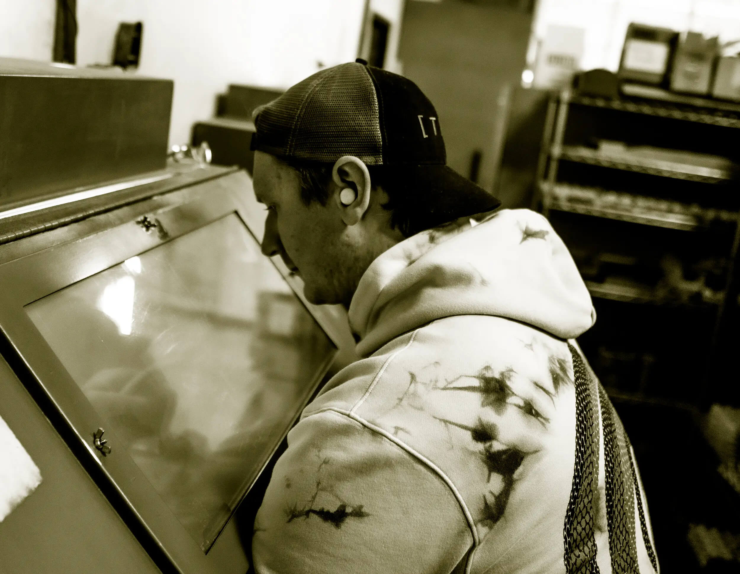 tacsol shop employee using spray booth