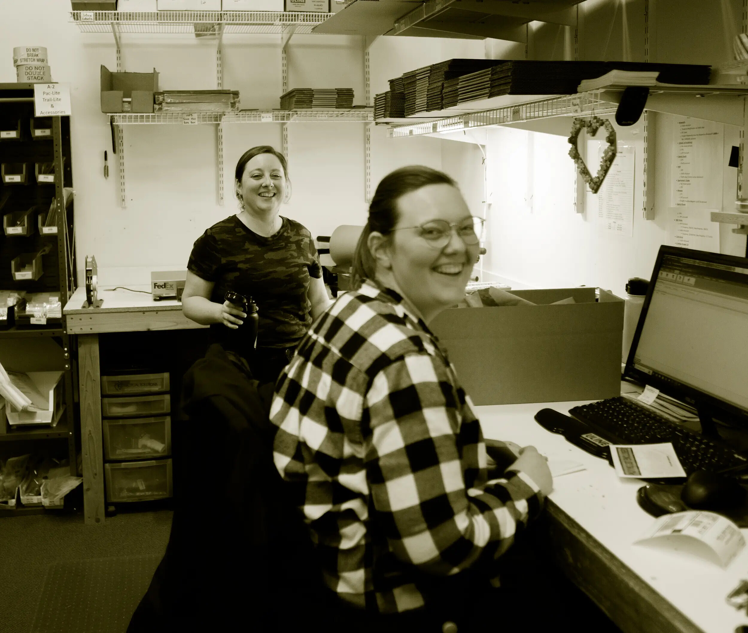 tacsol shipping department smiling at camera