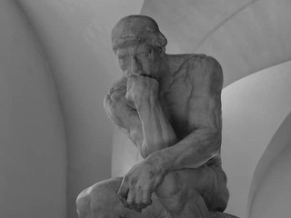 Frequently Asked Questions about Black Trumpet Mushrooms image of 'The Thinker' statue symbolizing contemplation and answers to common queries