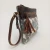 Jo Leather/Canvas Clutch by Backyard