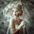 Romantic vintage portrait with blonde curls, lace details and antique parasol against floral backdrop