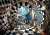 Alice in Wonderland-inspired decoupage paper featuring a surreal checkerboard tunnel, giant red mushrooms, floating playing cards, and antique keys in an enchanted forest.