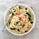 Roasted garlic capellini pasta dish pictured in a white bowl Roasted garlic capellini pasta dish pictured in a white bowl