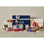 Assorted DeLallo sweets arranged on a marble table in front of a gift box