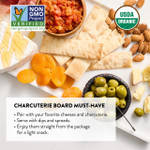 Charcuterie board with DeLallo Organic Focaccia Thins, olives, bruschetta and cheese.