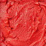 Close up shot of tomato paste out of package.