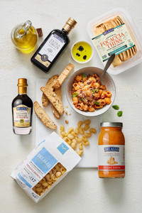 Downshot of assorted Italian food items in and out of packaging
