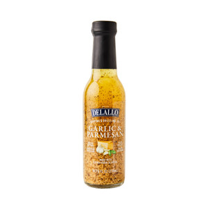 Front of garlic parmesan dipping oil in glass bottle