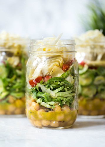 Raw Brussels Sprouts and Chick Pea Salad in a Jar with Artichokes, Sun Dried Tomatoes and Asiago