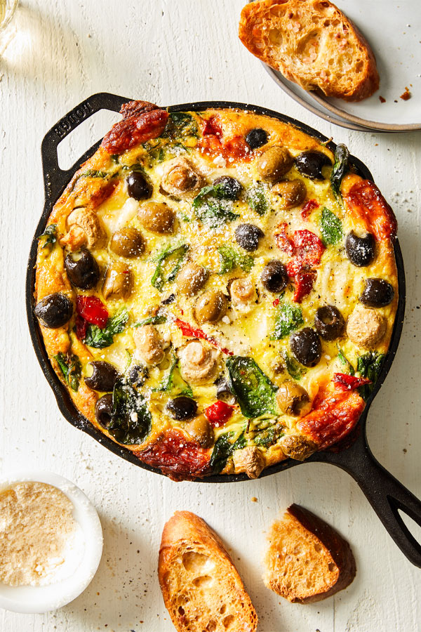 Egg frittata with olives, red peppers, and mushrooms.