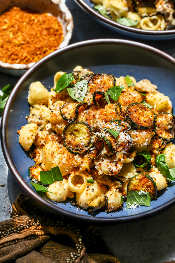 Caramelized zucchini with sausage and breadcrumbs in a bowl