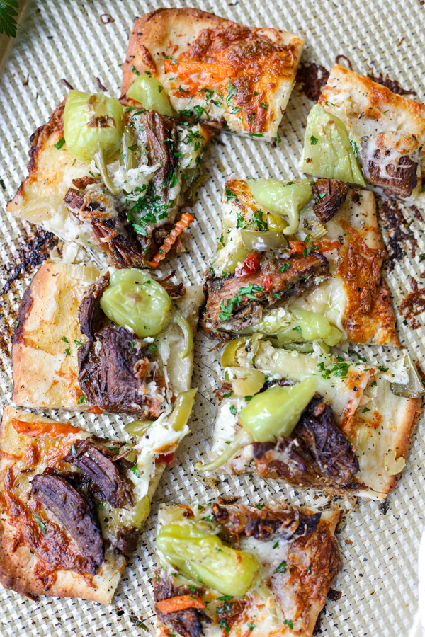 Flatbread pizza with giardiniera, pepperoncini and chuck roast.